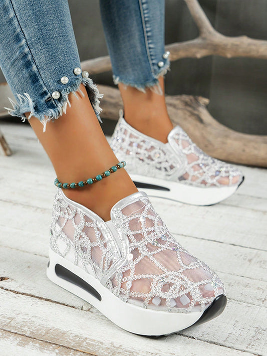 Elevate your sporty style with our sparkling sequins slip-on wedge <a href="https://canaryhouze.com/collections/women-canvas-shoes" target="_blank" rel="noopener">sneakers</a>. The perfect combination of comfort and fashion, these sneakers will add a touch of glam to any outfit. With their slip-on design and wedge heel, they are both practical and stylish. Experience the perfect blend of sport and sparkle with our sneakers.