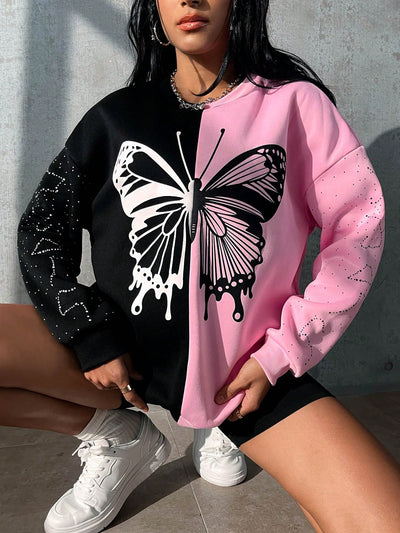 Add a touch of whimsy to your wardrobe with our Two-Tone Butterfly Print Drop Shoulder Sweatshirt. The eye-catching design will make you stand out in a crowd, while the drop shoulder style adds a casual, comfortable feel. Flutter in style and stay cozy all day with this unique sweatshirt.