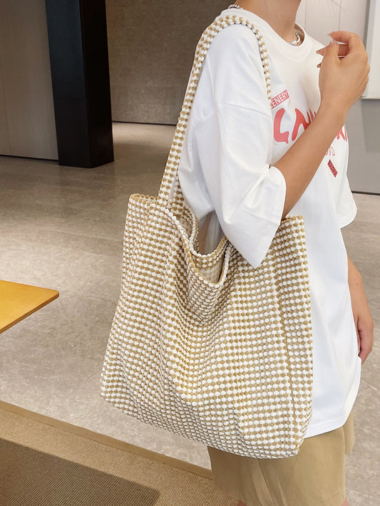 The Chic Woven Shoulder <a href="https://canaryhouze.com/collections/canvas-tote-bags" target="_blank" rel="noopener">Tote</a> is the perfect accessory for work, travel, and shopping. Its sleek and minimalist design adds an elegant touch to any outfit. With ample storage space, it's both practical and stylish. Elevate your wardrobe with this must-have handbag.