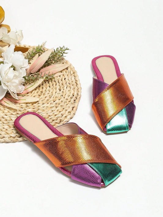 Introducing the must-have for women: Colorblock Snakeskin Embossed Square Toe Mule Flats. Combining fashion and comfort, these trendy flats feature a unique colorblock design and snakeskin embossed texture. Elevate your style game with these funky mules that are sure to make a statement.