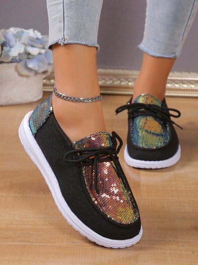 These stylish sneakers combine a sparkly, holographic sequin upper with a comfortable, stretch mesh slip-on construction. Perfect for adding pizzazz to any look, these shoes ensure lasting comfort with their breathable design and cushioning soles.