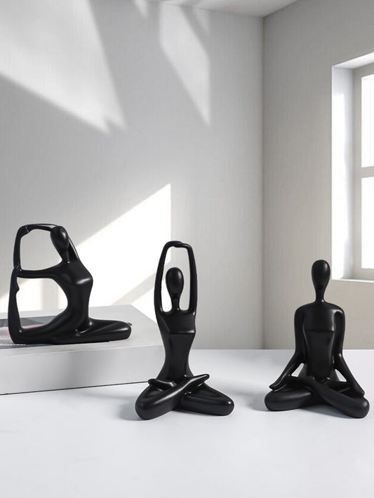 Enhance your home with our set of 3 black yoga figurines. These stylish <a href="https://canaryhouze.com/collections/ornaments" target="_blank" rel="noopener">decor</a> pieces add a touch of serenity and tranquility to any room. Perfect for yoga enthusiasts or those seeking a calming atmosphere. Made with high-quality materials and intricate designs, they are the perfect props for your yoga practice or as a unique addition to your decor.