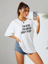 Be Bold and Express Yourself with our Slogan Graphic Drop Shoulder Tee