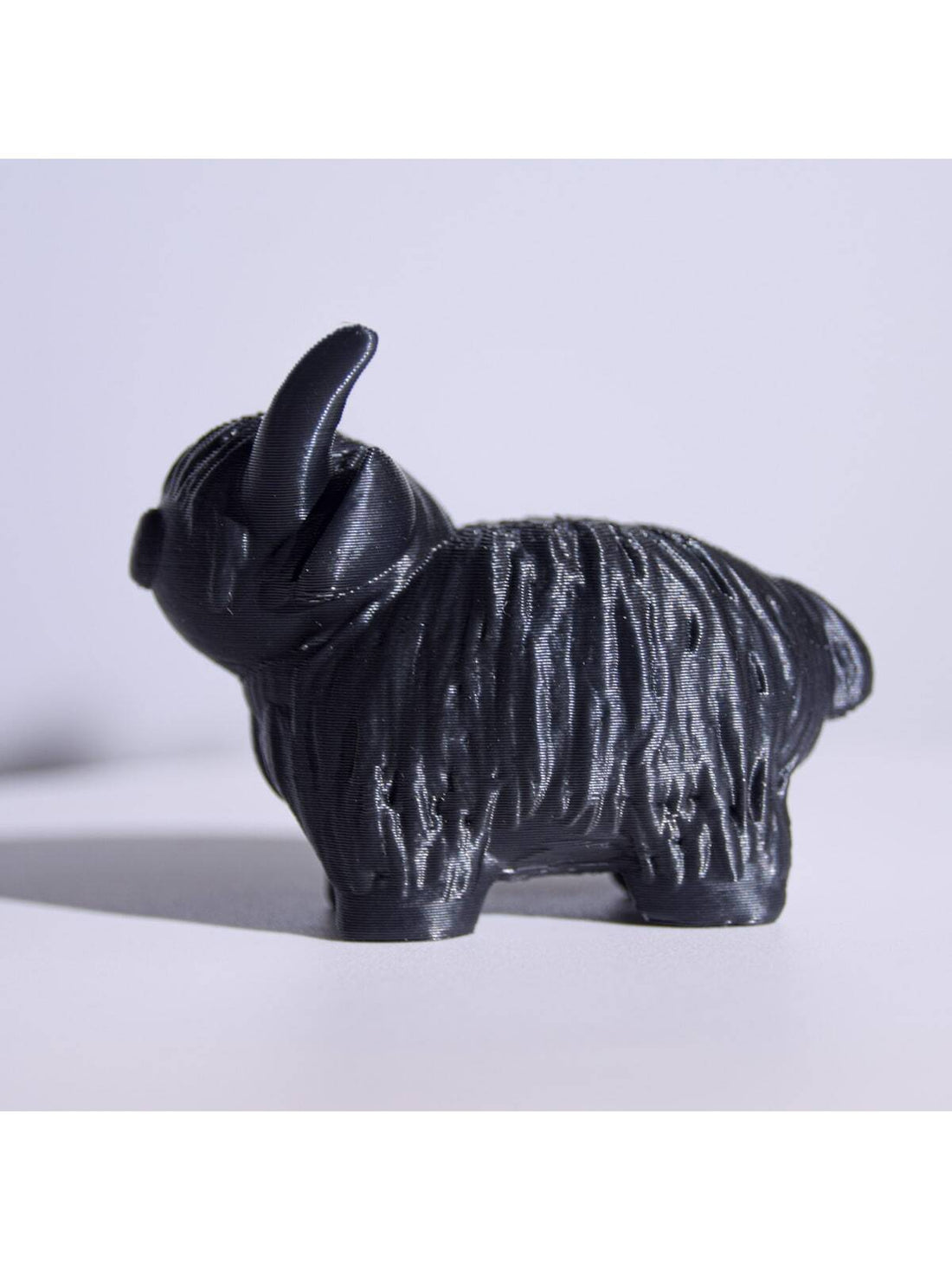 Our Exquisite 3D Printed Highland Cow Figurine is the perfect addition to any home decor. Made with precision and attention to detail, this must-have statue captures the beauty and charm of a Highland Cow. Elevate your decor with this unique and eye-catching piece.