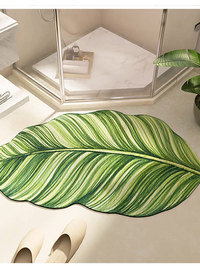Experience ultimate comfort and safety with our Leaf-Shaped Super Water Absorbent Bathroom <a href="https://canaryhouze.com/collections/rugs-and-mats" target="_blank" rel="noopener">Mat</a>. Its anti-slip rubber bottom provides a secure grip, while its unique leaf shape efficiently absorbs water, keeping you and your floor dry. A must-have for any bathroom, ensuring a relaxing and hazard-free experience.