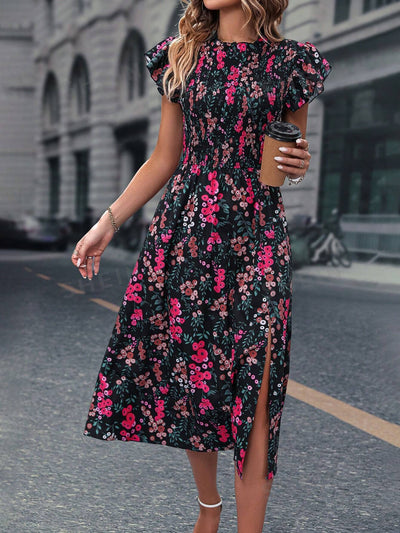 Introducing our Blooming Beauty <a href="https://canaryhouze.com/collections/women-dresses" target="_blank" rel="noopener">dress</a>, featuring a stunning floral print and elegant butterfly sleeves. The split thigh design adds a touch of sophistication to this must-have dress. Perfect for any occasion, show off your style in this statement piece.