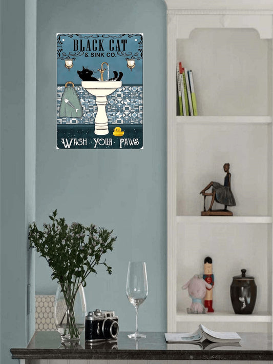 This Whimsical Wash Your Paws Black Cat Metal Tin Sign is a must-have for all cat lovers and vintage <a href="https://canaryhouze.com/collections/metal-arts" target="_blank" rel="noopener">decor</a> enthusiasts. Made of durable metal, it features a cute black cat with the phrase "Wash Your Paws" in a whimsical font. Perfect for adding a touch of charm to your home or cafe.