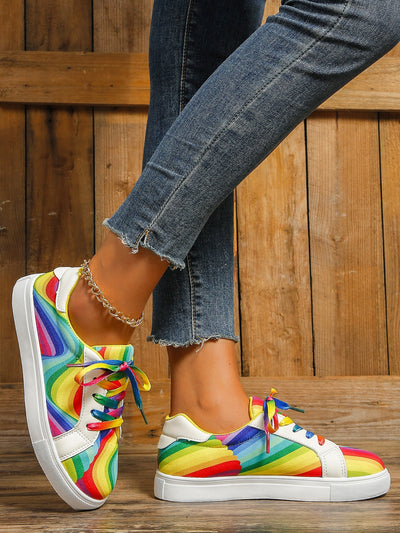 Experience comfort in style with Colorful Comfort Women's Rainbow Printed Flat Casual Sneakers. These sneakers feature a rainbow printed design with a flat, lightweight sole that offers great cushioning and flexibility for all-day wear. Enjoy a durable fit and lasting quality.