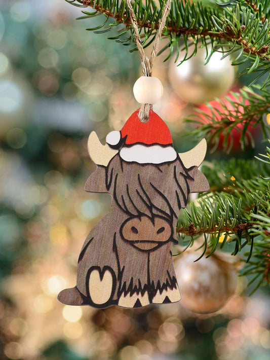 Add a touch of rustic charm to your holiday decor with our Western Christmas Charm ornament. Crafted from natural wood, the vintage hat-wearing mountain bull design evokes a sense of nostalgia and adds a unique twist to traditional decorations. Perfect for any country or western themed Christmas.