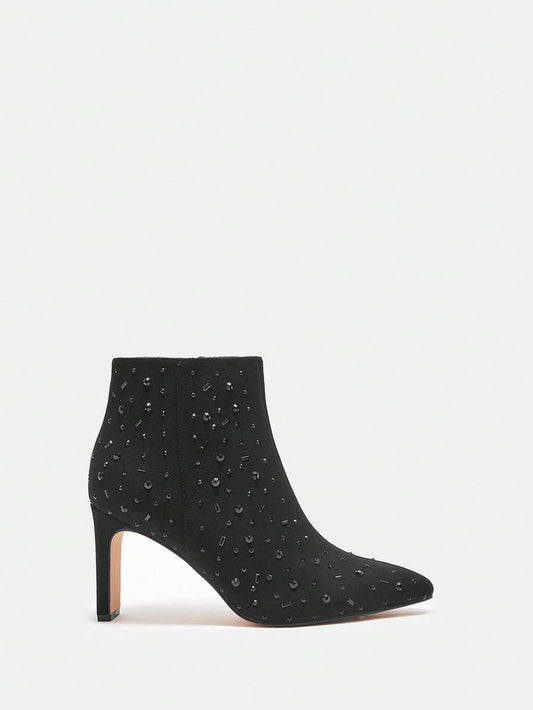 Elevate your style with our Sparkle in Style high heel ankle <a href="https://canaryhouze.com/collections/women-boots" target="_blank" rel="noopener">boots</a>. These stunning boots feature black rhinestone studs that will add a touch of glamour to any outfit. Crafted with quality materials, these boots are comfortable, stylish, and perfect for any occasion. Step out in confidence and shine with Sparkle in Style.