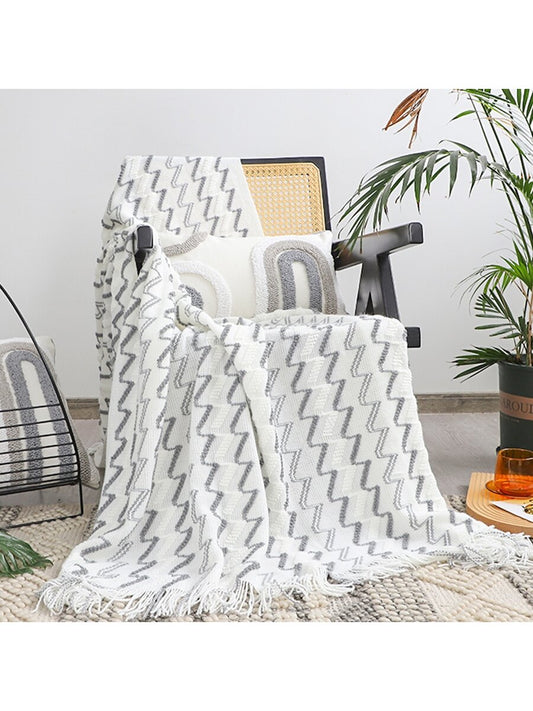 Stay warm and cozy with our Nordic Style Knitted Wave Stripe <a href="https://canaryhouze.com/collections/blanket" target="_blank" rel="noopener">Blanket</a>. Perfect for napping, working in the office, or curling up on the sofa or bed. The subtle wave and stripe design adds a touch of style to any room. Experience the ultimate comfort with this versatile throw.
