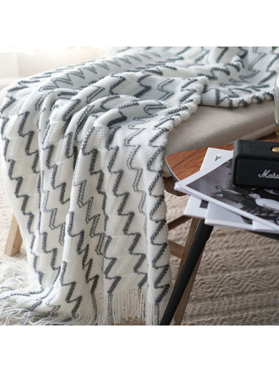 Stay warm and cozy with our Nordic Style Knitted Wave Stripe Blanket