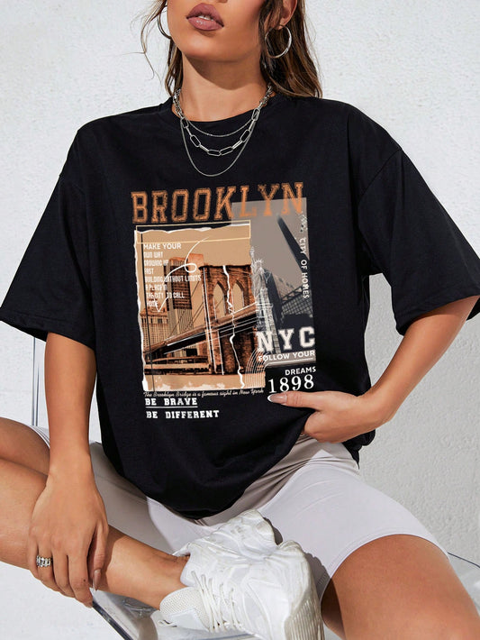 Get street style vibes with our Street View Vibes: Slogan Graphic Drop Shoulder Tee. This must-have tee features a bold slogan graphic, drop shoulder design, and comfortable fit. Perfect for taking your outfit to the next level and making a statement.