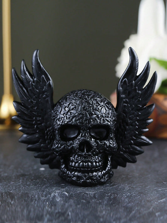 Discover the perfect addition to your home decor with our Winged Skull <a href="https://canaryhouze.com/collections/ornaments" target="_blank" rel="noopener">Ornament</a>. Add a touch of intrigue and mystery with this unique piece that embraces the darker side of life. Made of high-quality materials, it's a durable and stylish option that will elevate any room.