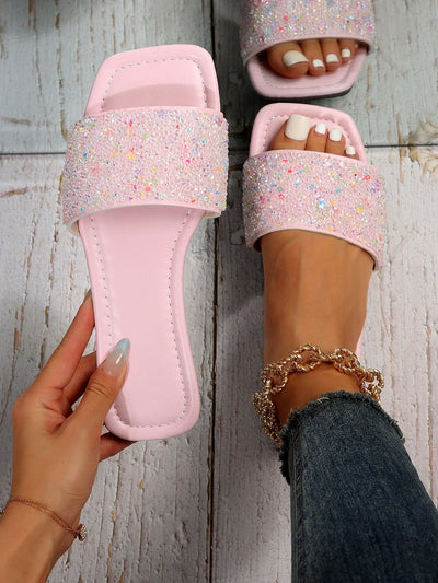 Upgrade your summer style with Sparkling Summer: Women's Plus Size Flat Sandals. Featuring stunning rhinestone embellishments, these sandals add a touch of glamour to any outfit. With a flat sole and comfortable fit, you'll stay stylish and comfortable all day long. Available in plus sizes for every woman to shine.