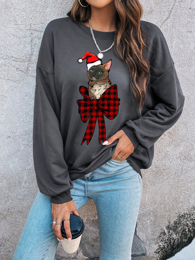 Get into the holiday spirit with our Christmas Cat Print Drop Shoulder Sweatshirt. Designed for both comfort and style, this sweatshirt is a purr-fect addition to your winter wardrobe. Made with soft, high-quality fabric, stay cozy and festive all season long.