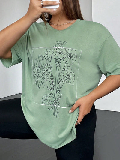 Stay on-trend with the Effortless Style: Floral Print Drop Shoulder Tee for Plus Size. With its comfortable fit and eye-catching floral print, this tee is the perfect addition to any plus size wardrobe. Its drop shoulder design adds a touch of effortless style, making it a must-have for any fashion-forward individual.