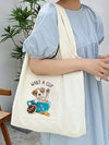 This stylish and versatile tote bag is the perfect accessory for any occasion. With a unique dog pattern, it adds a touch of fun and personality to your look. Its durable construction and spacious interior make it ideal for everyday use, while its fashionable design makes it a statement piece.