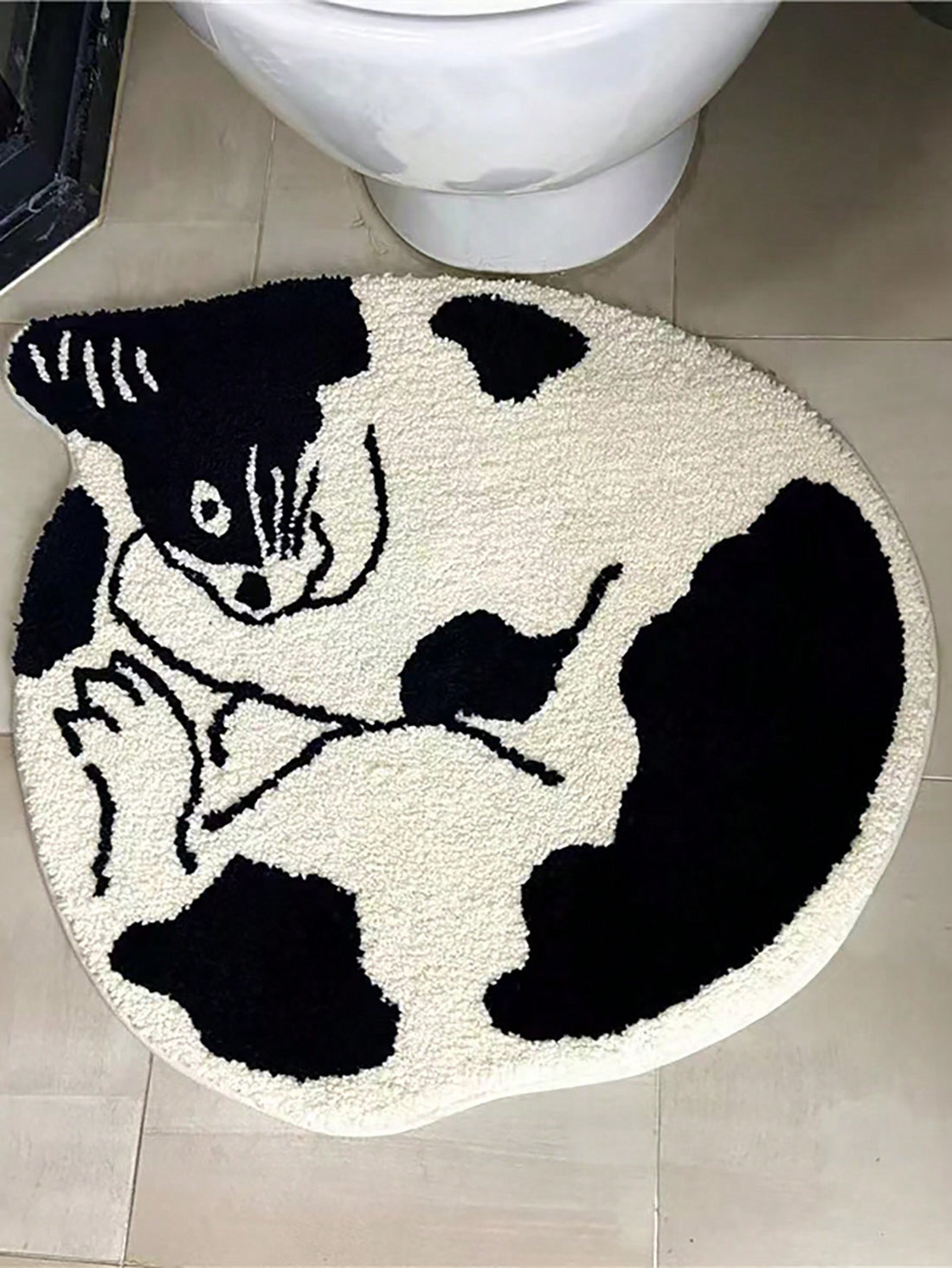 Add a cozy touch to your home with our Soft and Stylish Black and White Cat Patterned Rug. Made with a soft and durable fabric, it's a perfect addition to any room. Transform your space with this charming rug that adds both style and comfort.