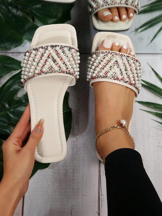 Get ready for the warm seasons with our Fashionable Faux Pearl Flat <a href="https://canaryhouze.com/collections/women-canvas-shoes" target="_blank" rel="noopener">Sandals</a>! These stylish sandals are perfect for Spring, Autumn, and Summer, making them a versatile addition to your shoe collection. The faux pearl detailing adds a touch of elegance, while the flat design provides both comfort and fashion. Perfect for any occasion!