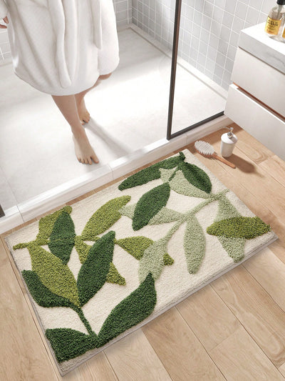 This Bamboo Leaf Pattern Plush Forest Bathroom <a href="https://canaryhouze.com/collections/rugs-and-mats?sort_by=created-descending" target="_blank" rel="noopener">Mat</a> provides a soft, absorbent, and anti-slip surface for your bathroom. Made with a unique bamboo leaf pattern, it adds a touch of nature to your space. Keep your feet comfortable and dry while preventing slips and falls with this high-quality mat.