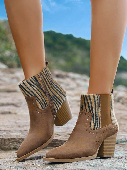 Experience true western style with our Wild West Chic Vintage Zebra Pattern Cowboy Boots. Made with expert craftsmanship and high-quality materials, these boots are perfect for those looking to add a touch of the wild to their wardrobe. The unique zebra pattern adds a fun and bold twist to a classic cowboy boot design. Order yours today!