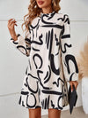 Upgrade your style with the Effortlessly Chic: Graphic Print Mock Neck Lantern Sleeve Dress. The mock neck and lantern sleeves add a touch of elegance, while the graphic print adds a modern twist. Made with high-quality materials, this dress is designed for both comfort and style. Elevate your wardrobe with this must-have piece.