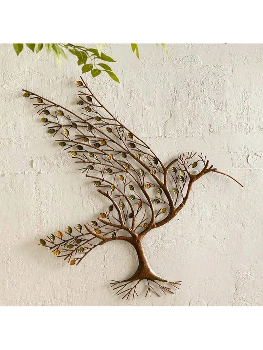 Introduce an air of whimsy and elegance into your home decor with this stunning Hummingbird Metal Wall Decoration. Crafted from durable iron and shaped like a tree branch, this sculpture adds a touch of nature to any room. Perfect for special occasions or as a unique everyday piece.