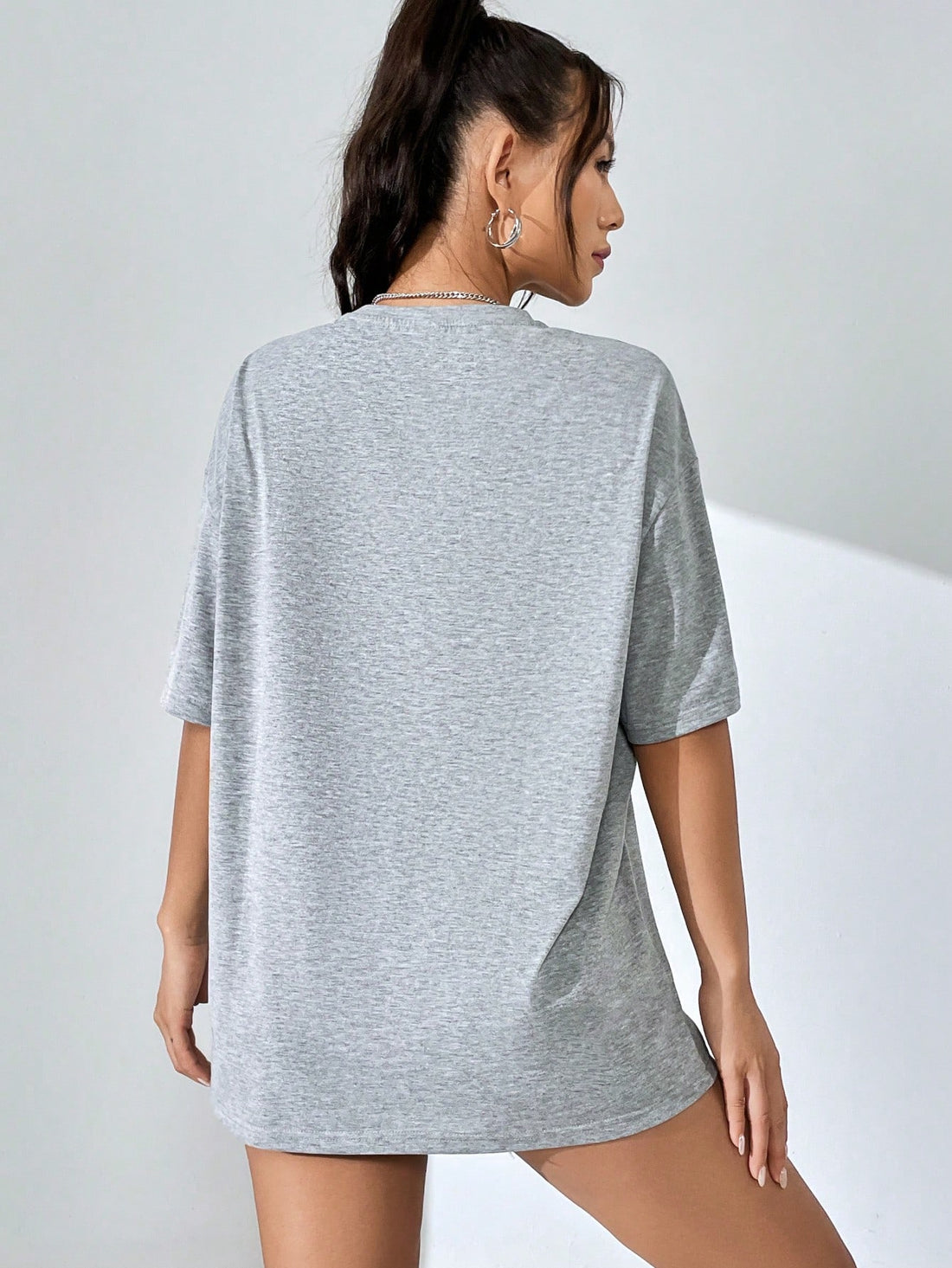 Stay comfortable and stylish with our Loose Fit Women's Letter Printed Drop Shoulder T-Shirt. Made with a loose fit and drop shoulder design, you'll have freedom of movement while staying on-trend. Plus, the letter print adds a cool touch to any outfit.