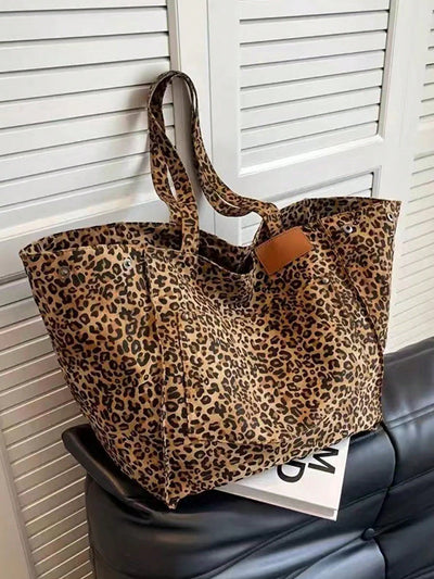 Introducing the Chic Leopard Print <a href="https://canaryhouze.com/collections/canvas-tote-bags" target="_blank" rel="noopener">Tote Bag</a>, the perfect companion for your daily commute. Featuring a stylish leopard print design, this tote bag is not only chic, but also highly functional. With ample space and sturdy construction, it's the ultimate commuter's must-have. Upgrade your daily routine with this fashionable and practical tote bag.