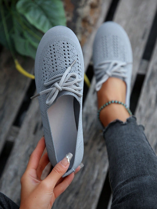 These flat shoes combine chic style and comfortable fit with its lace-up knitted mesh design. Perfect for everyday wear, these <a href="https://canaryhouze.com/collections/women-canvas-shoes" target="_blank" rel="noopener">shoes</a> provide both fashion and functionality. The gray color adds a touch of sophistication to any outfit. Step out in style and comfort with Chic and Comfy.