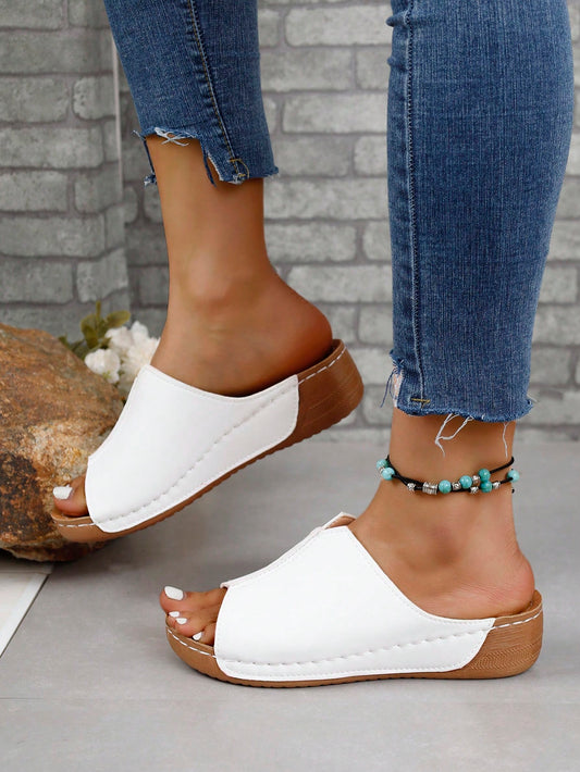 Step up your fashion game with our Stylish Summer Platform Wedge <a href="https://canaryhouze.com/collections/women-canvas-shoes" target="_blank" rel="noopener">Sandals</a>. Elevate your style with these black and white slip-ons that will add a touch of sophistication to any summer outfit. With their comfortable platform wedge design, you'll look and feel effortlessly chic.