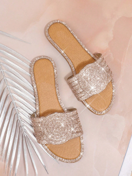 Sparkling Steps brings you the ultimate in fashion and comfort with these elegant Rhinestone Flat Sandals for women. These sandals are designed to add a touch of glamour and sparkle to any outfit, while also providing support and comfort for all-day wear. Elevate your style game with Sparkling Steps