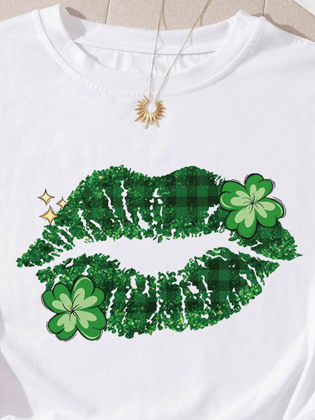 Elevate your style with our Plus Size Women's Lips Clover Pattern Printed T-Shirt. This stunning top features a unique lips and clover pattern that will make you stand out from the crowd. Its comfortable and flattering fit is perfect for any occasion. Be confident and stylish with our t-shirt.