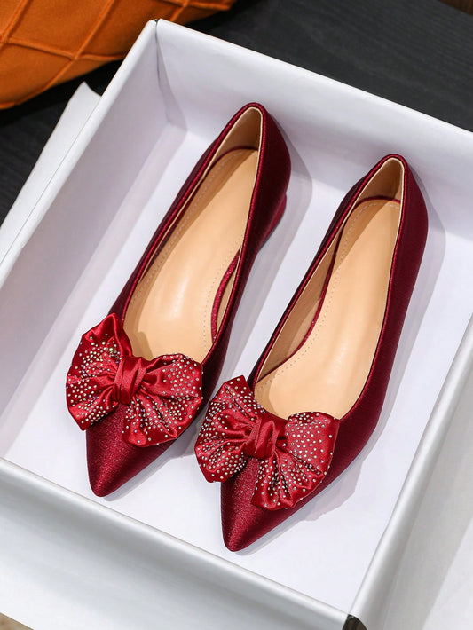 Designed with a stylish red bowknot and sparkling rhinestones, these flats are perfect for any season and occasion! The comfortable fit and versatile style make them a must-have for any fashionista. Elevate any outfit with these eye-catching Red Bowknot Rhinestone Flat <a href="https://canaryhouze.com/collections/women-canvas-shoes" target="_blank" rel="noopener">Shoes</a>!