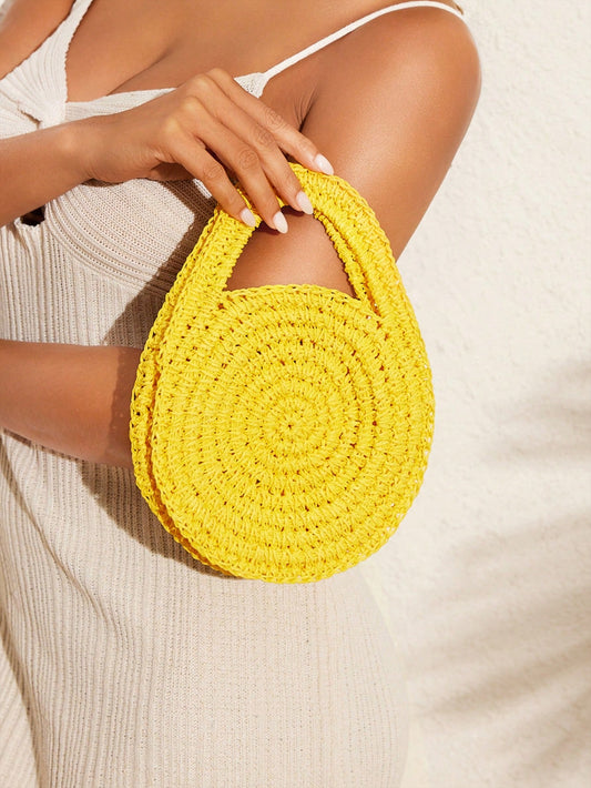 Introducing the Sun-Kissed Style Yellow Handwoven Straw <a href="https://canaryhouze.com/collections/canvas-tote-bags" target="_blank" rel="noopener">Bag</a>, perfect for summer beach travel and outdoor holidays. Made from high-quality straw, this bag offers both style and functionality. Carry your essentials in a sun-kissed fashion with this must-have accessory.