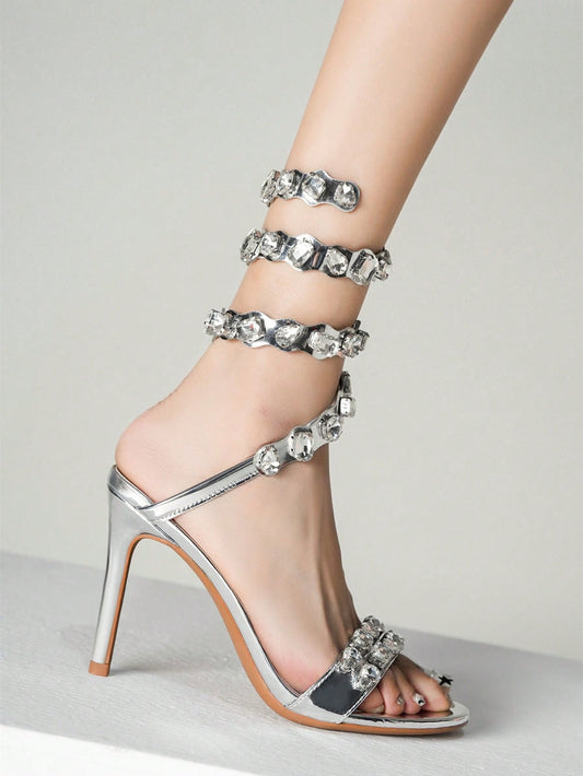 Elevate your special occasion look with our Sparkling Elegance stiletto heels. Adorned with rhinestone rivet decor, these silver heels add a touch of sparkle to your wedding party attire. Expertly crafted for both style and comfort, these heels are the perfect choice for an elegant and glamorous event.