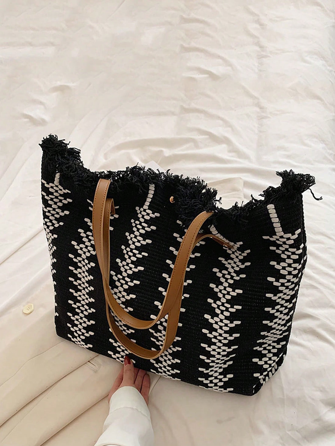 Stay stylish and organized for your beach days with our Summer Chic Straw <a href="https://canaryhouze.com/collections/canvas-tote-bags" target="_blank" rel="noopener">Tote Bag</a>. Made of lightweight straw and featuring fringed details, it's perfect for carrying your essentials. Enjoy a fashionable and carefree summer with this must-have accessory.