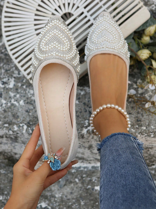 Elevate your shoe collection with our Pearl-Embellished Flat Shoes. These stylish flats combine the comfort of a flat with the elegance of pearls, making them the perfect choice for both spring and autumn. With their unique design and versatile style, these shoes are sure to become a staple in your wardrobe.
