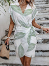 Enviable Vacation Style: Women's Plant-Printed Wrap Dress with Tie-Waist Detail