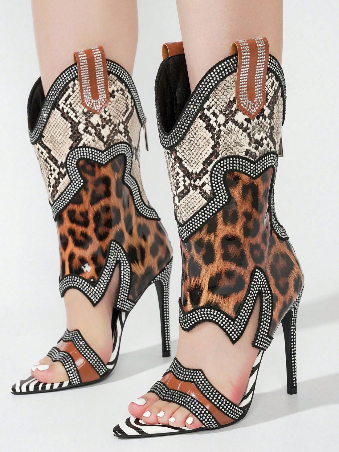 Enhance your style with Sparkle and Shine: Nanaye Rhinestone Trim Open Toe <a href="https://canaryhouze.com/collections/women-canvas-shoes" target="_blank" rel="noopener">High Heels</a>. These stunning high heels feature rhinestone trim and an open toe design, adding a touch of glamour to any outfit. Walk with confidence and stand out from the crowd with these chic and sophisticated heels.