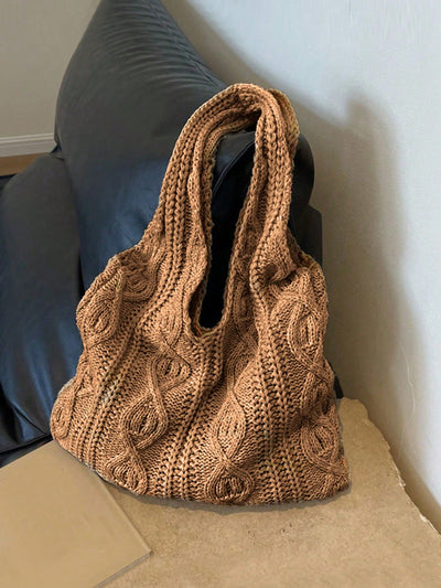 This knitted shoulder <a href="https://canaryhouze.com/collections/canvas-tote-bags" target="_blank" rel="noopener">bag</a> is the perfect accessory for your summer beach or casual outings. With its stylish design, it easily complements any outfit. Made with high-quality materials, it offers durability and comfort. Keep your essentials organized and secure while looking chic with this must-have bag.