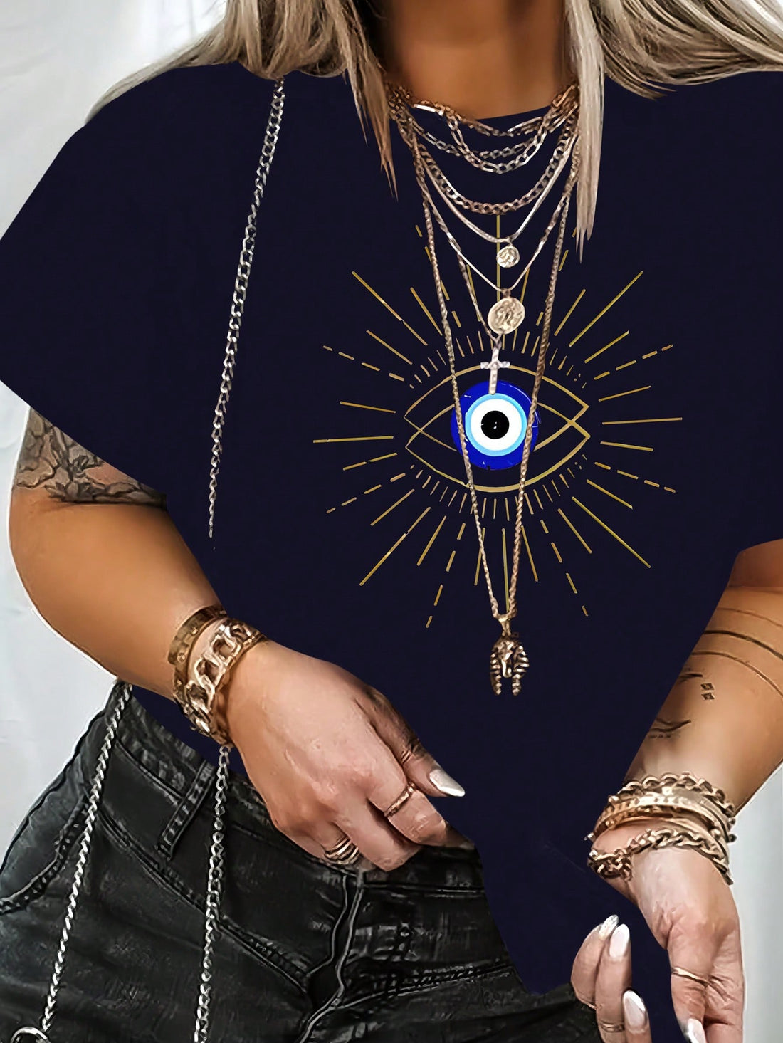 Introducing the Eye-Catching Curves Plus Size Eye Print Round Neck <a href="https://canaryhouze.com/collections/tshirt" target="_blank" rel="noopener">T-Shirt</a>. With its bold eye print design and flattering round neck, this shirt is sure to turn heads. Made for the modern, stylish woman, this shirt is the perfect addition to any wardrobe.