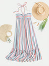 Update your summer wardrobe with our Chic and Colorful maxi dress! Designed with multicolor vertical stripes and a halter neck, this dress is perfect for a day at the beach or a night out. Made from lightweight material, it offers a stylish and comfortable fit. Show off your fashion-forward style with this trendy dress.