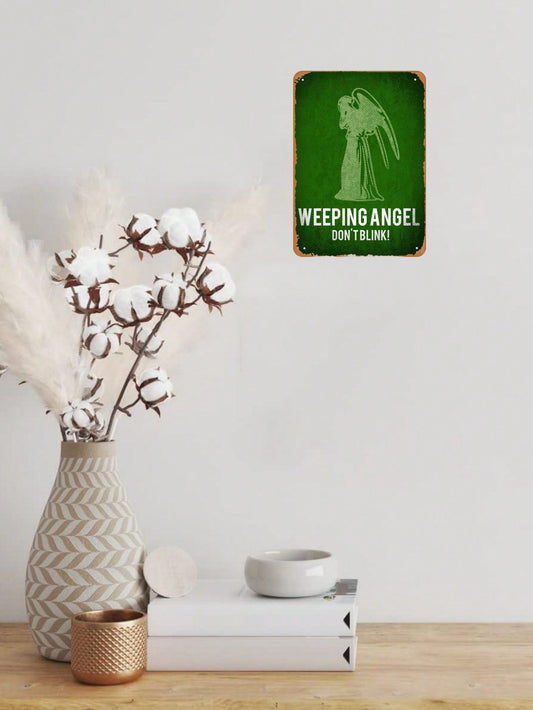 This <a href="https://canaryhouze.com/collections/metal-arts" target="_blank" rel="noopener">vintage metal</a> tin sign featuring a weeping angel is perfect for adding a touch of nostalgia to any space. Hang it in your home, bar, cafe, or garage for a unique and eye-catching decor piece. Made of high-quality materials, it is durable and long-lasting. Add a touch of vintage charm to your space with this beautiful and versatile sign.