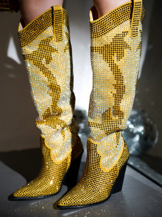 Elevate your style with Sparkling in Style: Malinde Rhinestone Embellished Knee-High <a href="https://canaryhouze.com/collections/women-boots" target="_blank" rel="noopener">Boots</a>. These stunning boots feature sparkling rhinestone embellishments, adding a touch of glamour to any outfit. With a knee-high design, these boots offer both fashion and function, keeping your legs warm and protected. Perfect for any occasion, these boots are sure to make a statement.