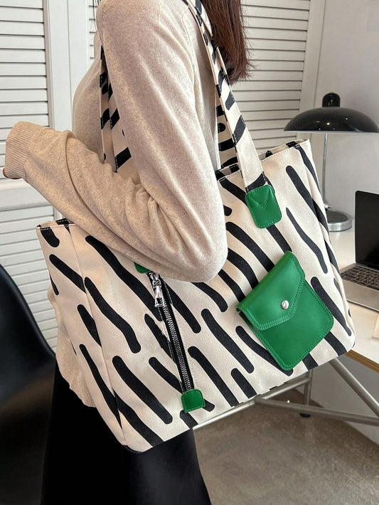 Introducing Versatile Chic, the must-have <a href="https://canaryhouze.com/collections/canvas-tote-bags" target="_blank" rel="noopener">handbag</a> for any woman on-the-go. Made of durable striped canvas, this bag is perfect for outdoor activities, school, and work. With its simple design, it's both stylish and functional. Upgrade your wardrobe with this versatile accessory.
