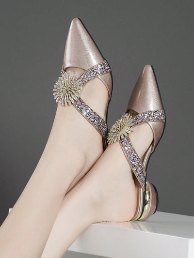 Add a touch of elegance to your wardrobe with our Sparkling Elegance heels. Featuring stunning rhinestone detailing and a <a href="https://canaryhouze.com/collections/women-canvas-shoes" target="_blank" rel="noopener">chunky heel</a>, these shoes will surely make a statement. The cut-out back design adds a unique touch, while offering comfort and style. Elevate any outfit with these show-stopping heels.