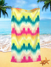 The Wave Ombre Pattern Microfiber Beach <a href="https://canaryhouze.com/collections/towels" target="_blank" rel="noopener">Towel</a> is a must-have for all your beach travels. Its unique design and microfiber material make it lightweight, quick-drying, and sand-resistant. Stay stylish and comfortable with this essential travel companion.