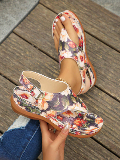 Upgrade your summer wardrobe with our Summer Chic Floral Print Wedge Heel Peep Toe <a href="https://canaryhouze.com/collections/women-canvas-shoes" target="_blank" rel="noopener">Sandals</a>. The vibrant floral design adds a touch of playfulness to any outfit, while the comfortable wedge heel provides a confident boost of height. Perfect for both casual and formal occasions, these sandals are a versatile addition to your collection.